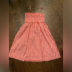 Gently used girl’s dress. Size 10. Orange and white.